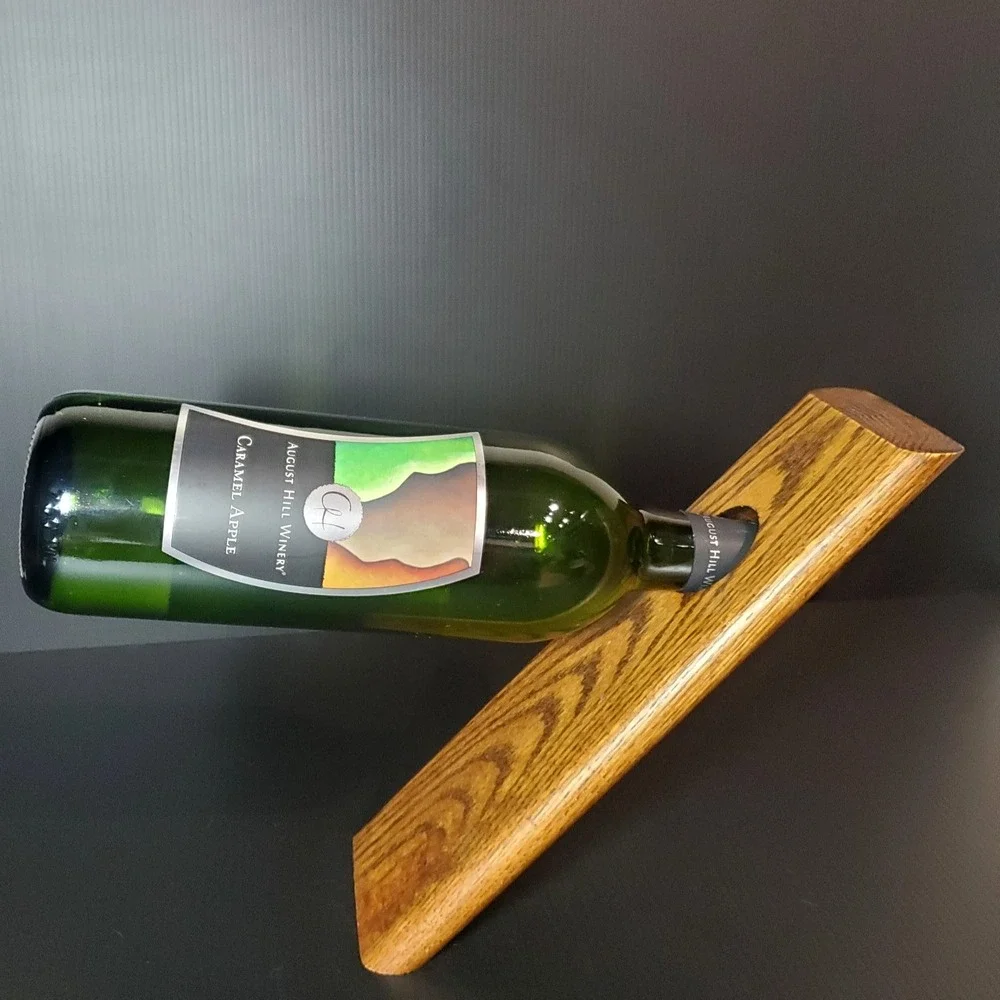 Balancing wine bottle holder, holds a single bottle,‎ solid oak wood